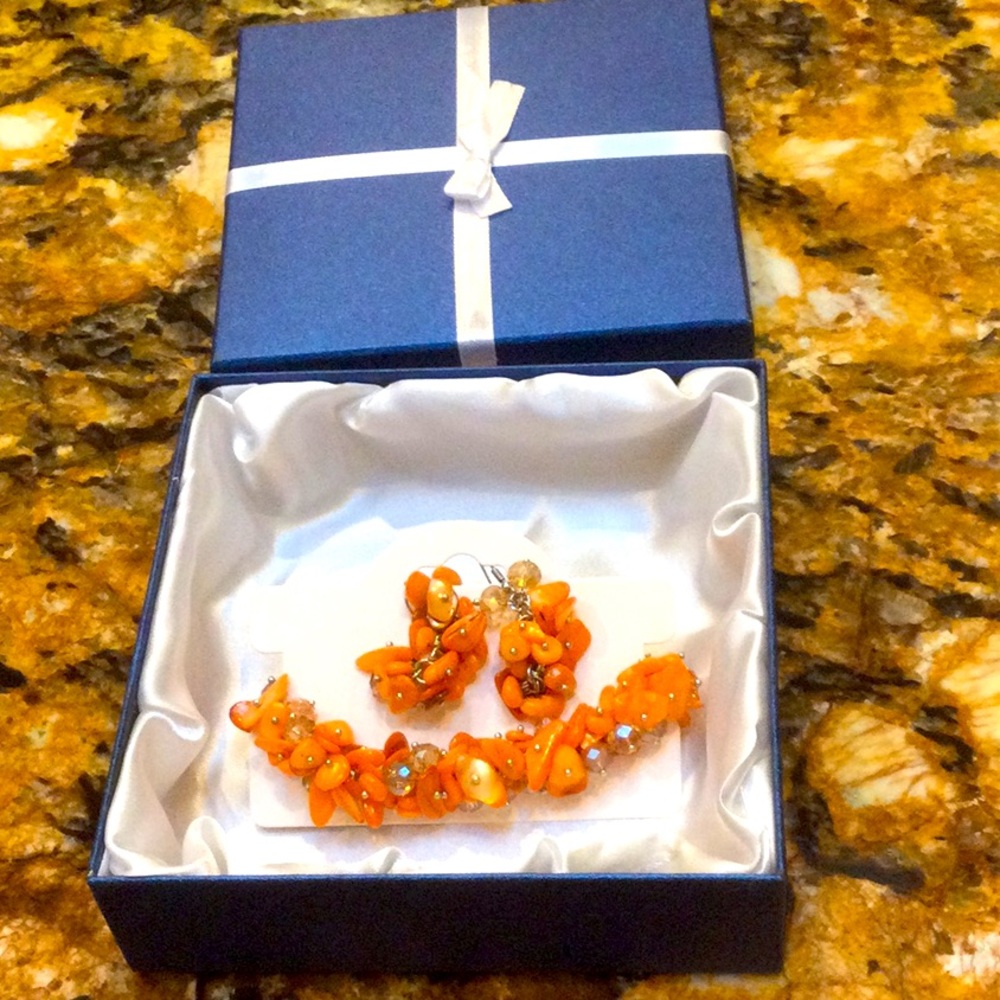 - - Beautiful coral colored magnet bracelet and earring set